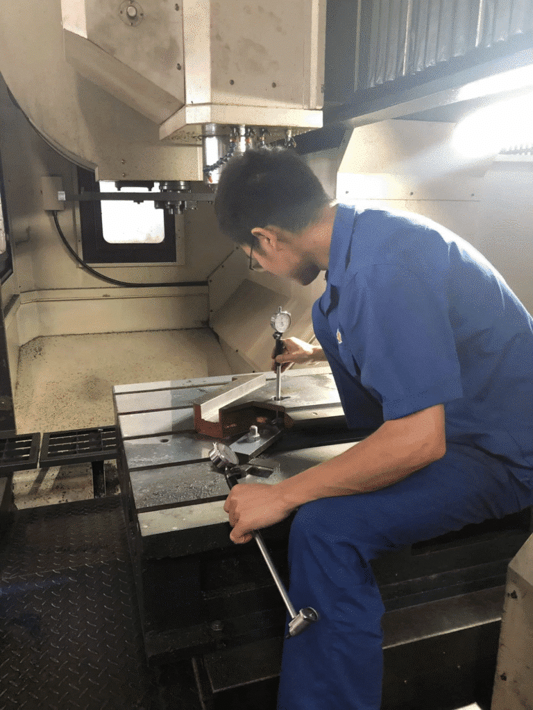 engineer using dial indicator to verify precision of CNC-machined component in Chinese printing machinery factory