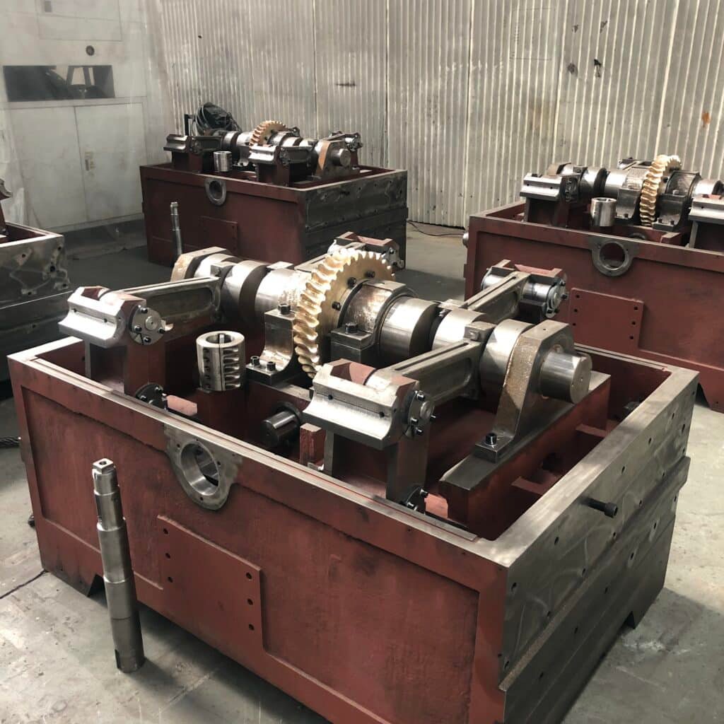 Internal view of a precision gearbox showing gears and bearings, essential components that must be maintained to prevent vibration and ensure accurate registration in die cutting.