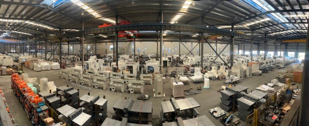 panoramic view of DAIS Printing Machinery factory floor with hundreds of automatic die cutters, paper cutters, and laminators ready for global shipment