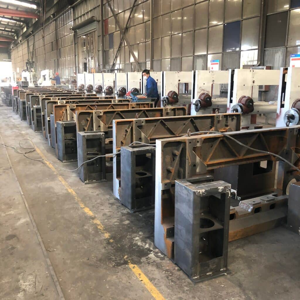 Manufacturing process of industrial paper cutter welded bases and internal frames