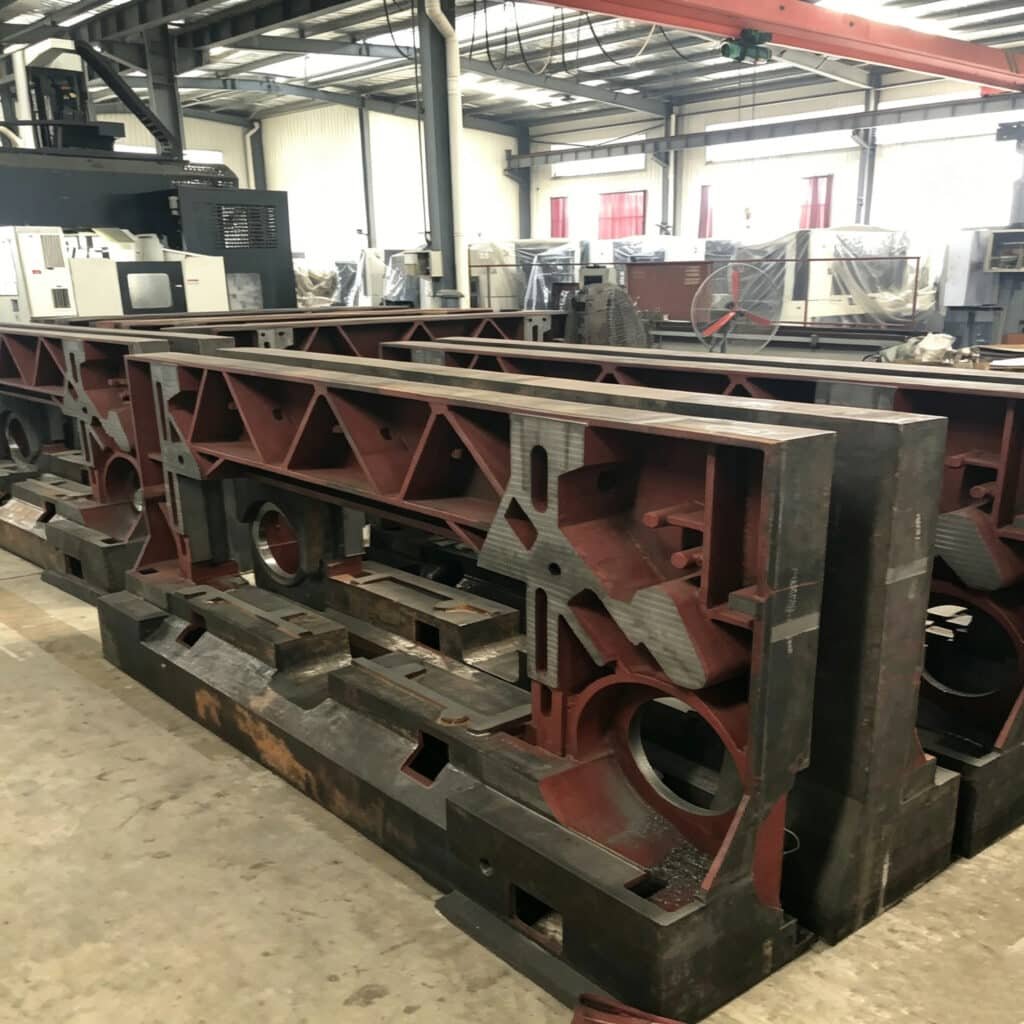 Close-up of heavy-duty cast iron base and structural components for automatic paper cutting machines, ensuring long-term durability