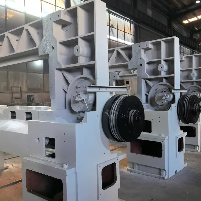 Heavy-duty mechanical structure and drive system of an industrial paper cutter.