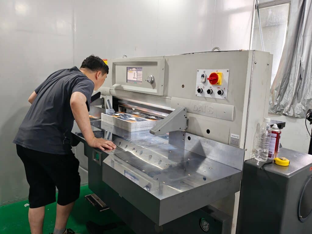 Precision cutting of printed materials in a packaging application
