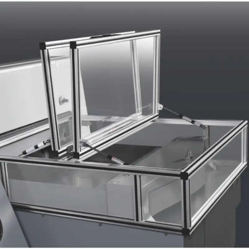 Safety protection guard and light curtain system on a paper cutting machine.