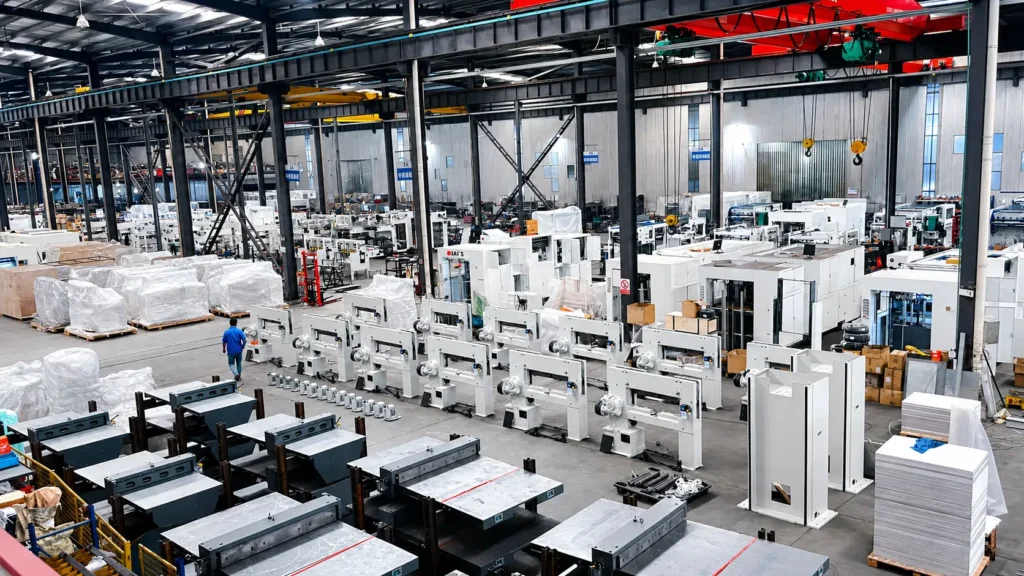 Factory floor with multiple hydraulic and mechanical paper cutting machines ready for mass production