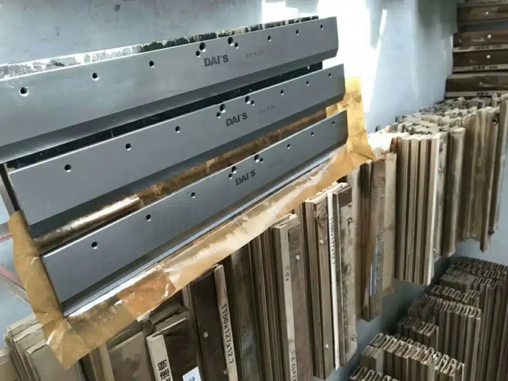 Industrial cutting blades requiring regular sharpening for paper cutting machines