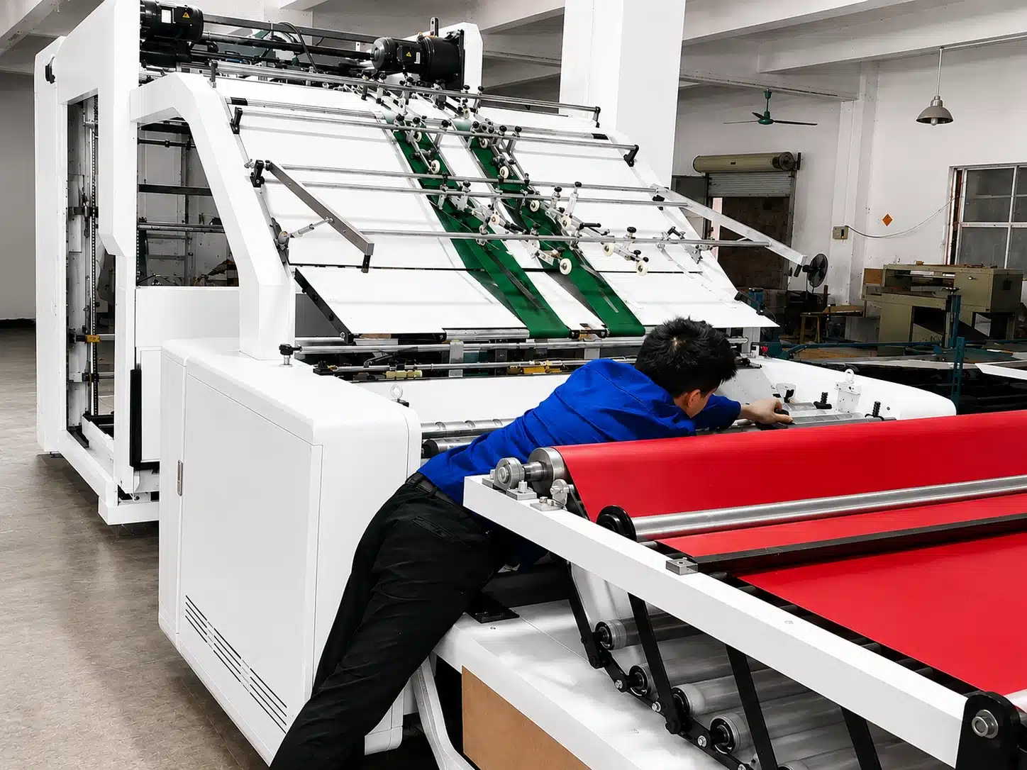 DAIS engineer installing and commissioning automatic laminating machine