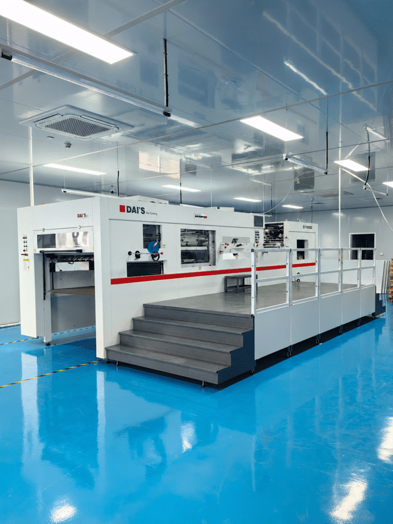 1060mm automatic die cutting machine for paperboard packaging production showing automatic feeding and finished carton blanks